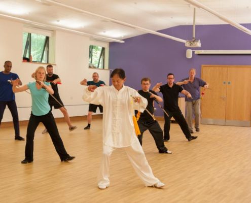 Tai Chi instructor and group